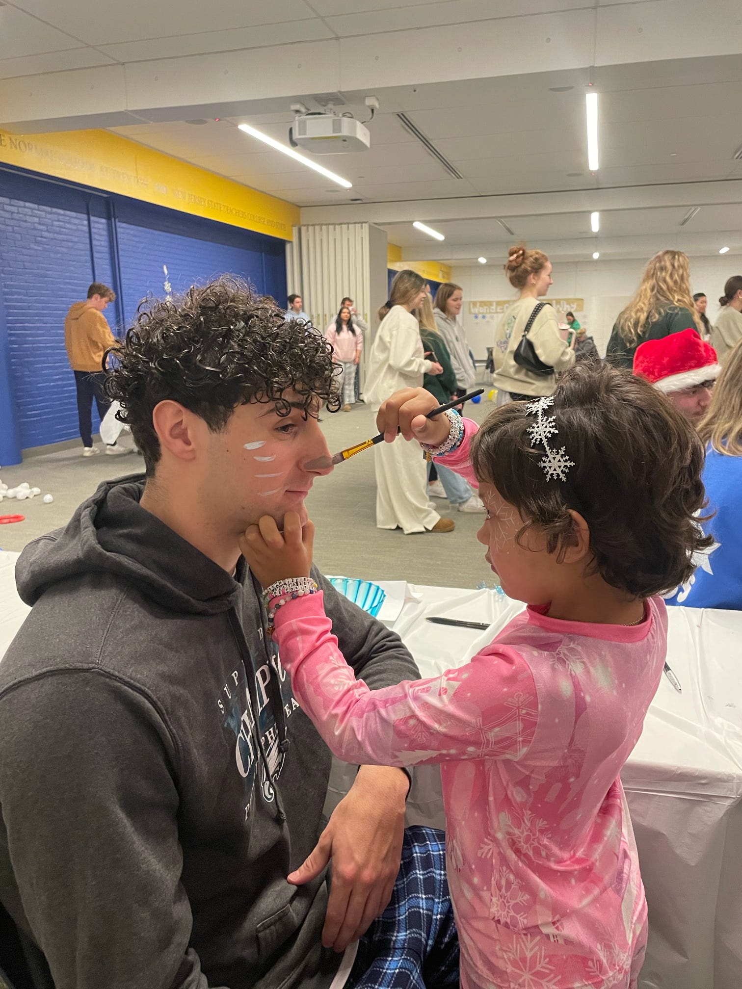 Face painting during a B+ community event